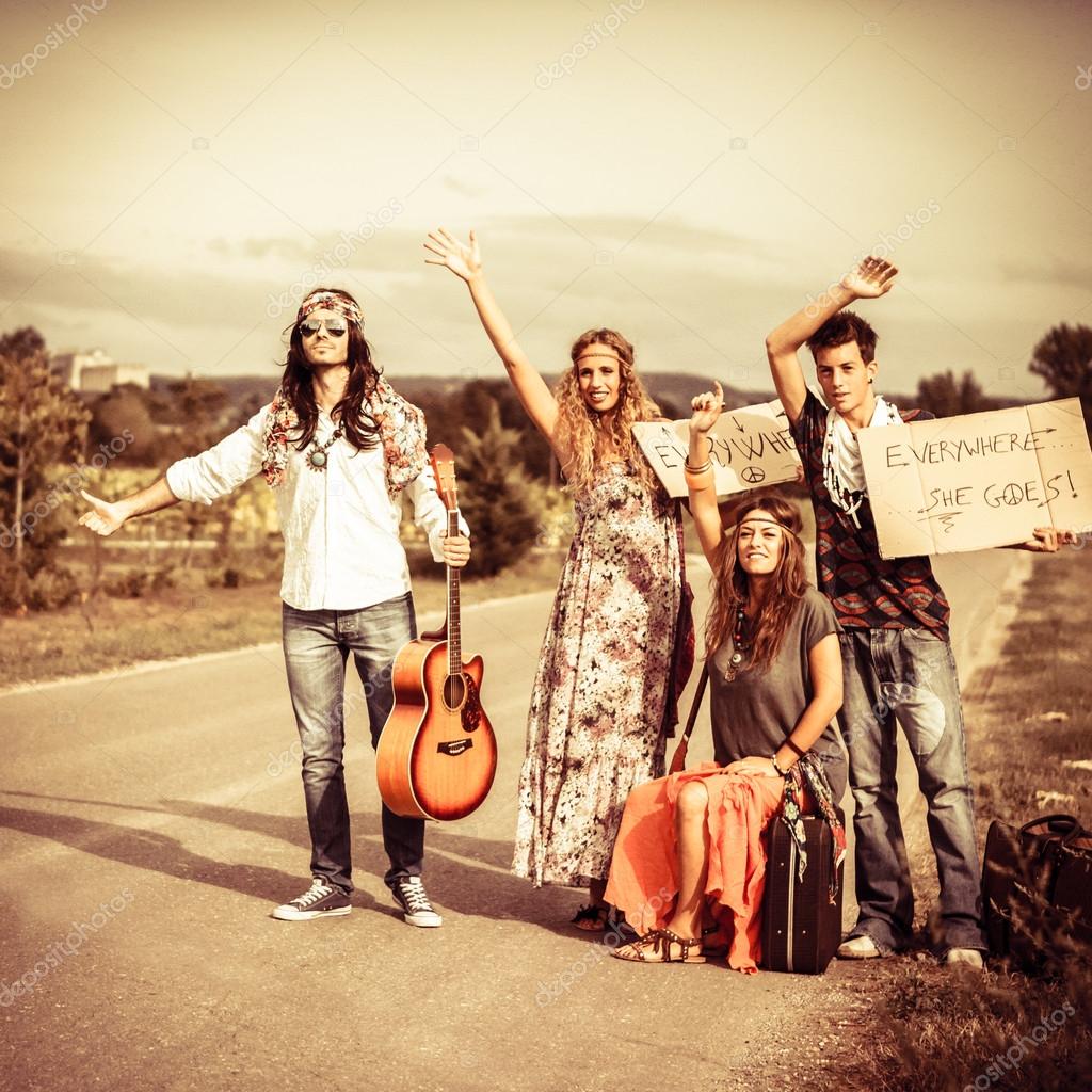 depositphotos_122931776-stock-photo-hippies-hitchhiking-on-the-road.jpg
